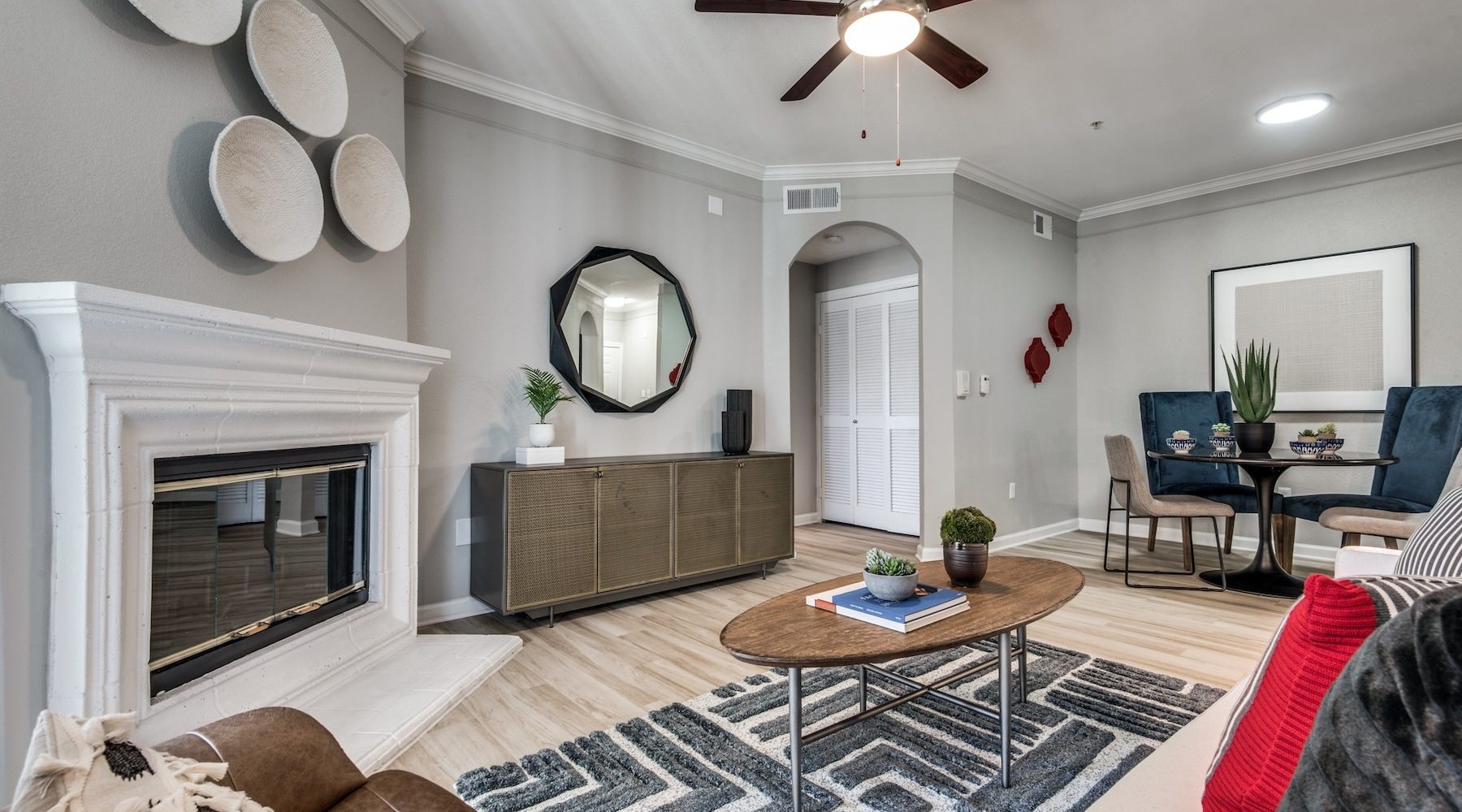 Refined spaces to match your style living room with seating table and fire place