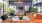 a lounge with a large couch tv and windows