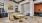 a room with tables and chairs and kitchen