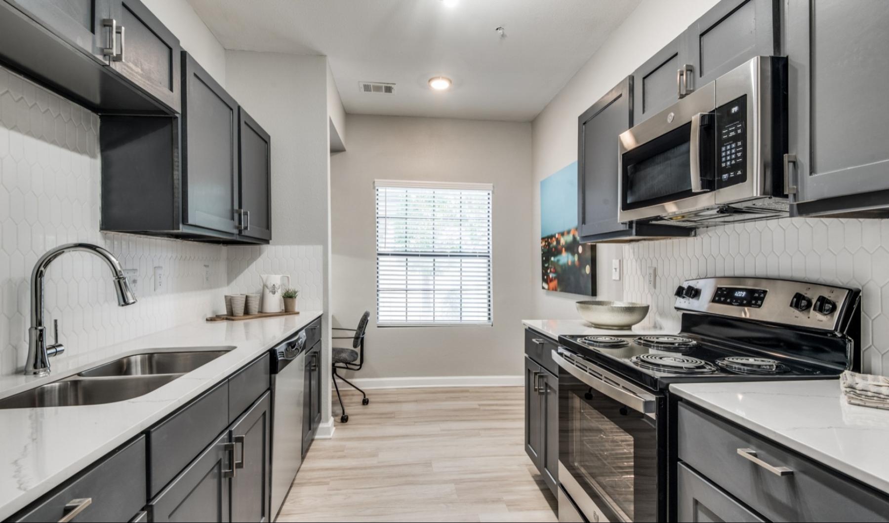 a kitchen with black appliances