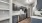 a kitchen with grey cabinets
