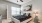 a bedroom with a bed and a lamp