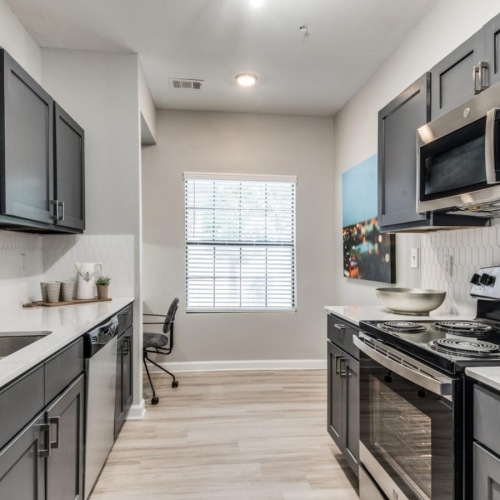 a kitchen with black appliances