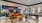 a large room with a pool table and shuffle board table