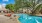 a swimming pool with a building behind it