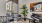 a room with a seating piano and a plant