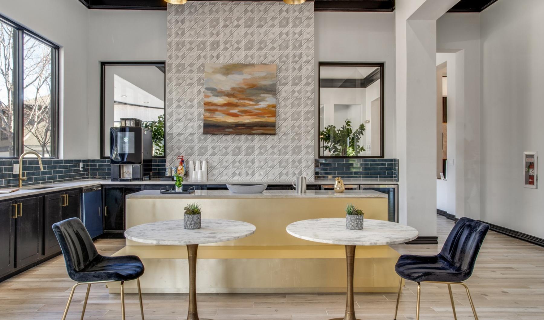 a kitchen with a table and chairs