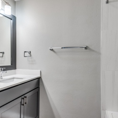 Spacious bathrooms with everything you need a bathroom with a sink and a mirror