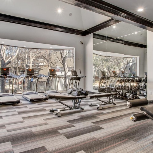 Quick access to state-of-the-art amenities a gym with exercise equipment